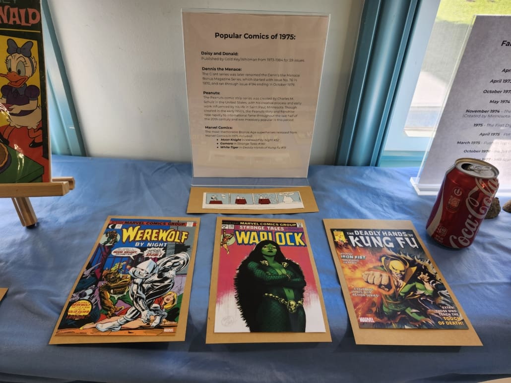 Photos of each of the first appearance comics of Moon Knight, Gamora, and Ghost Rider. Also, a small strip of a Snoopy Comic.