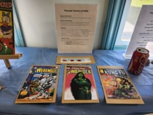 Photos of each of the first appearance comics of Moon Knight, Gamora, and Ghost Rider. Also, a small strip of a Snoopy Comic.